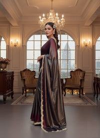 Soft shimmer Sabyasachi-inspired designer saree draped elegantly, showcasing intricate embroidery and delicate lace details.