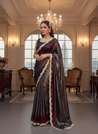 Soft shimmer Sabyasachi-inspired designer saree draped elegantly, showcasing intricate embroidery and delicate lace details.
