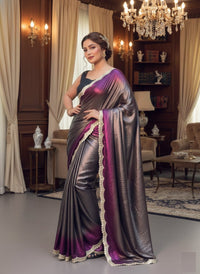 Soft shimmer Sabyasachi-inspired designer saree draped elegantly, showcasing intricate embroidery and delicate lace details.