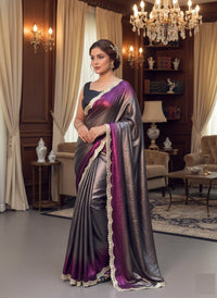 Soft shimmer Sabyasachi-inspired designer saree draped elegantly, showcasing intricate embroidery and delicate lace details.