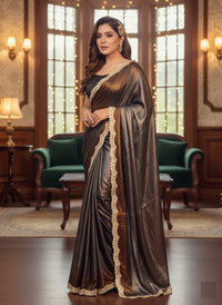 Soft shimmer Sabyasachi-inspired designer saree draped elegantly, showcasing intricate embroidery and delicate lace details.