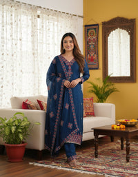 Heavy Pure Chinon Silk Embroidered 3-Piece Suit Set featuring a richly embroidered kurta, matching pure silk bottoms, and a complementary dupatta, showcasing intricate threadwork and luxurious fabric texture.