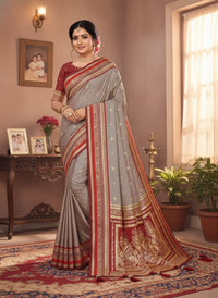 Elegantly draped Pure Handloom Kalamkari Silk Saree with intricate hand-painted motifs and a shimmering gold Zari border on luxurious silk.