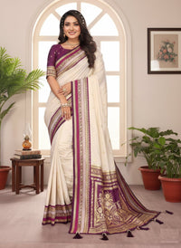 Elegantly draped Pure Handloom Kalamkari Silk Saree with intricate hand-painted motifs and a shimmering gold Zari border on luxurious silk.