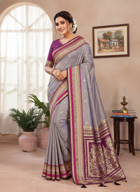 Elegantly draped Pure Handloom Kalamkari Silk Saree with intricate hand-painted motifs and a shimmering gold Zari border on luxurious silk.