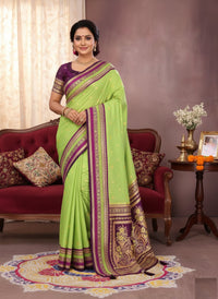 Elegantly draped Pure Handloom Kalamkari Silk Saree with intricate hand-painted motifs and a shimmering gold Zari border on luxurious silk.