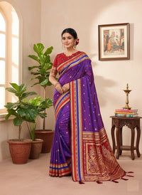 Elegantly draped Pure Handloom Kalamkari Silk Saree with intricate hand-painted motifs and a shimmering gold Zari border on luxurious silk.