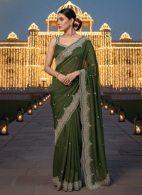 Elegant woman in a vibrant Star Georgette Party Wear Saree featuring heavy golden embroidery and intricate Moti (pearl) work