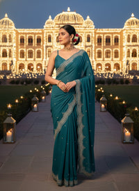 Elegant woman in a vibrant Star Georgette Party Wear Saree featuring heavy golden embroidery and intricate Moti (pearl) work