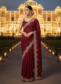 Elegant woman in a vibrant Star Georgette Party Wear Saree featuring heavy golden embroidery and intricate Moti (pearl) work