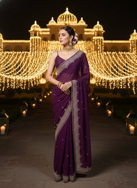 Elegant woman in a vibrant Star Georgette Party Wear Saree featuring heavy golden embroidery and intricate Moti (pearl) work