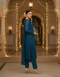 Front view of an elegant Salwar Kameez featuring intricate tonal embroidery and delicate scalloped lace detailing.