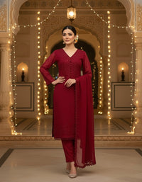 Front view of an elegant Salwar Kameez featuring intricate tonal embroidery and delicate scalloped lace detailing.