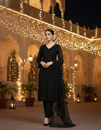 Front view of an elegant Salwar Kameez featuring intricate tonal embroidery and delicate scalloped lace detailing.