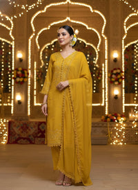 Front view of an elegant Salwar Kameez featuring intricate tonal embroidery and delicate scalloped lace detailing.