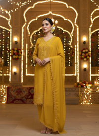 Front view of an elegant Salwar Kameez featuring intricate tonal embroidery and delicate scalloped lace detailing.