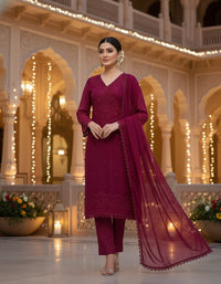 Front view of an elegant Salwar Kameez featuring intricate tonal embroidery and delicate scalloped lace detailing.
