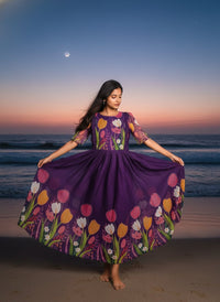 Model in a Midnight Garden purple maxi gown with a vibrant tulip print and delicate ruffle details, perfect for elegant evening events.