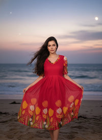 Model in a Midnight Garden purple maxi gown with a vibrant tulip print and delicate ruffle details, perfect for elegant evening events.