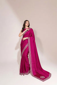 Model wearing a luxurious Soft Shimmer Silk Saree with intricate Swarovski crystal embellishments, diamond work, and elegant lace design details.