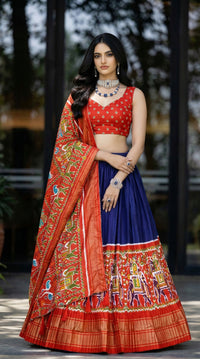 Traditional Patola Paithani Dola Silk Lehenga featuring a vibrant print, intricate foil work, and a delicate Gotta Patti lace border with decorative tassels.
