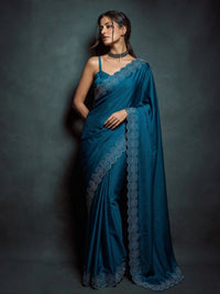 Full-length view of a model draped in a Luxe Hollywood Satin Saree with a complementary Banglori blouse featuring intricate running Jarkan lace.