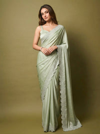 Full-length view of a model draped in a Luxe Hollywood Satin Saree with a complementary Banglori blouse featuring intricate running Jarkan lace.