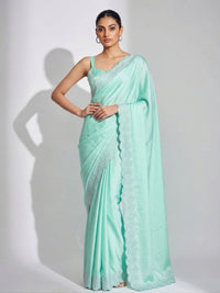 Full-length view of a model draped in a Luxe Hollywood Satin Saree with a complementary Banglori blouse featuring intricate running Jarkan lace.