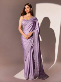 Full-length view of a model draped in a Luxe Hollywood Satin Saree with a complementary Banglori blouse featuring intricate running Jarkan lace.