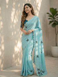 Close-up of an elegant butterfly handwork saree with intricate embroidery details, showcased on a mannequin.