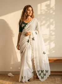 Close-up of an elegant butterfly handwork saree with intricate embroidery details, showcased on a mannequin.