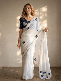 Close-up of an elegant butterfly handwork saree with intricate embroidery details, showcased on a mannequin.