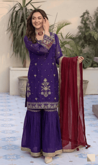 Model in full designer sequin Jimmy Choo palazzo set and elegant crancy dupatta, showcasing luxury party wear.