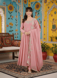 Elegant embroidered Anarkali three-piece set featuring intricate sequence work on a designer ethnic outfit.