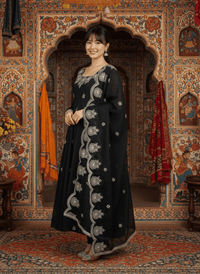 Elegant embroidered Anarkali three-piece set featuring intricate sequence work on a designer ethnic outfit.
