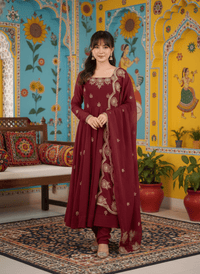 Elegant embroidered Anarkali three-piece set featuring intricate sequence work on a designer ethnic outfit.