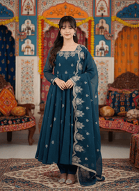 Elegant embroidered Anarkali three-piece set featuring intricate sequence work on a designer ethnic outfit.