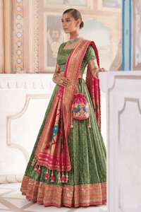 Elegant Simmer Organza Lehenga with ornate zari weaving work and a delicate lace border detail